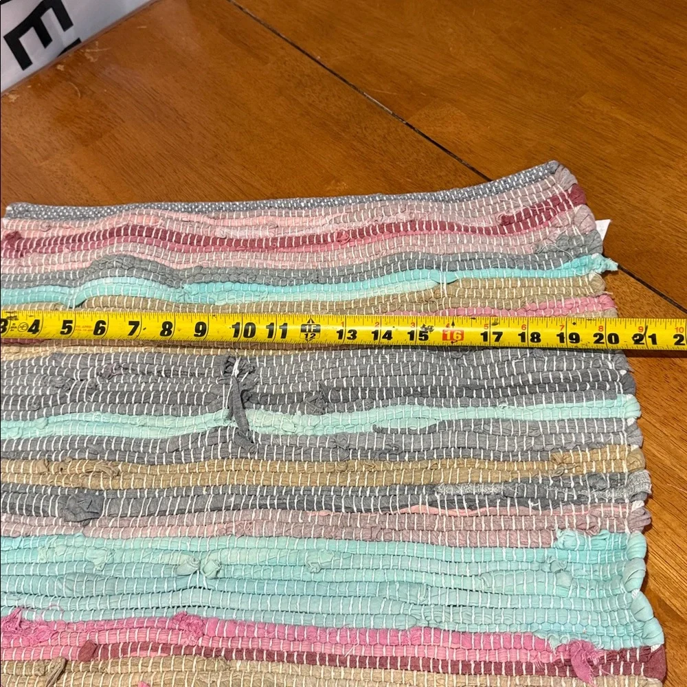 Woven multicolored rag rug.